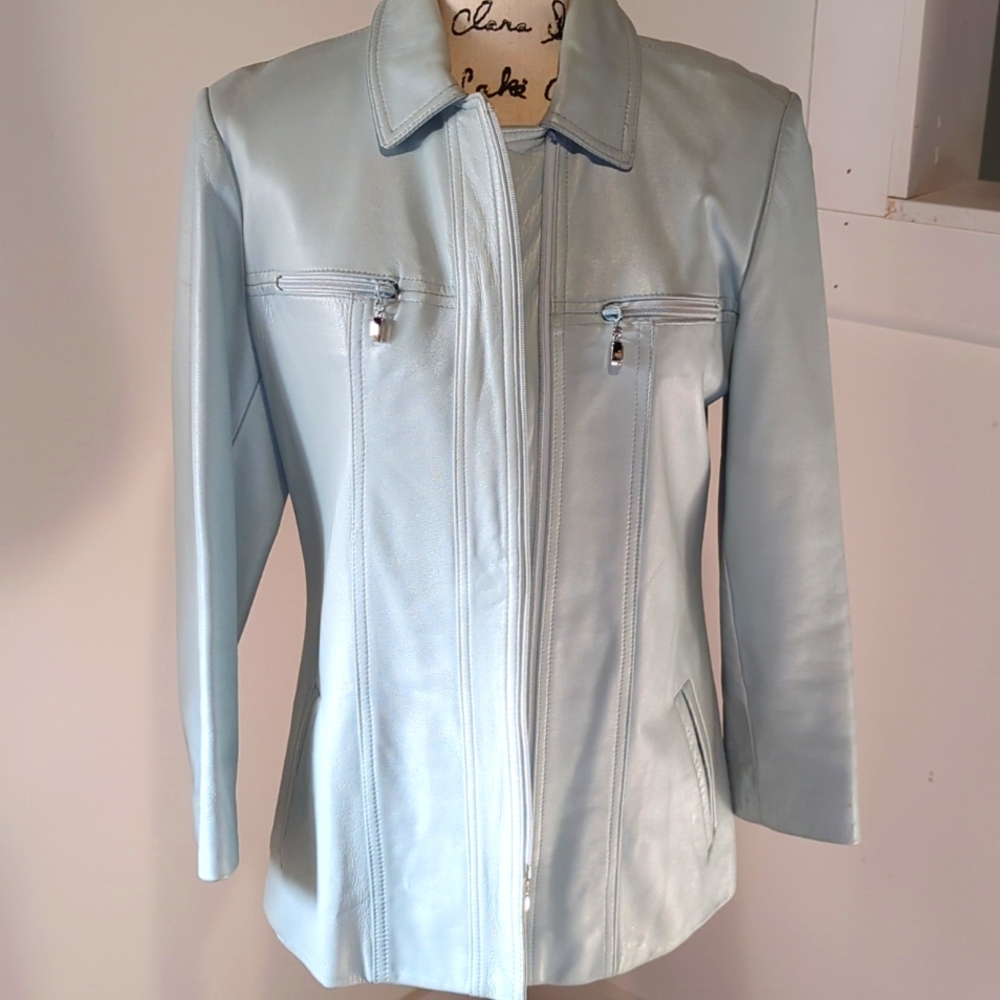 St John light blue leather jacket with blue slacks.